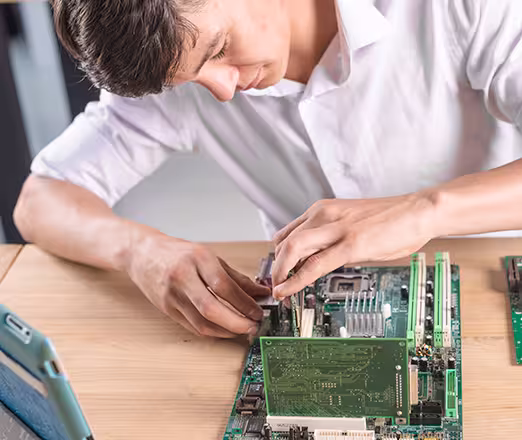 Student practicing repair techniques during practical session of AC PCB repairing course in Gurgaon